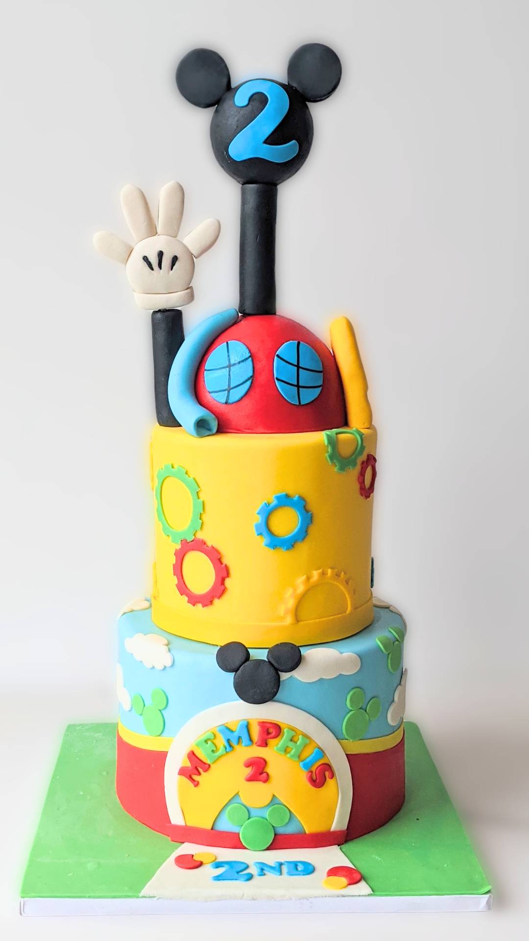 Colorful stacked cake with Mickey Mouse topper