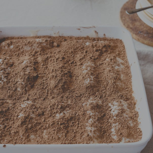Tiramisu dessert in a white dish