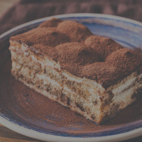 Slice of layered dessert on a blue and white plate