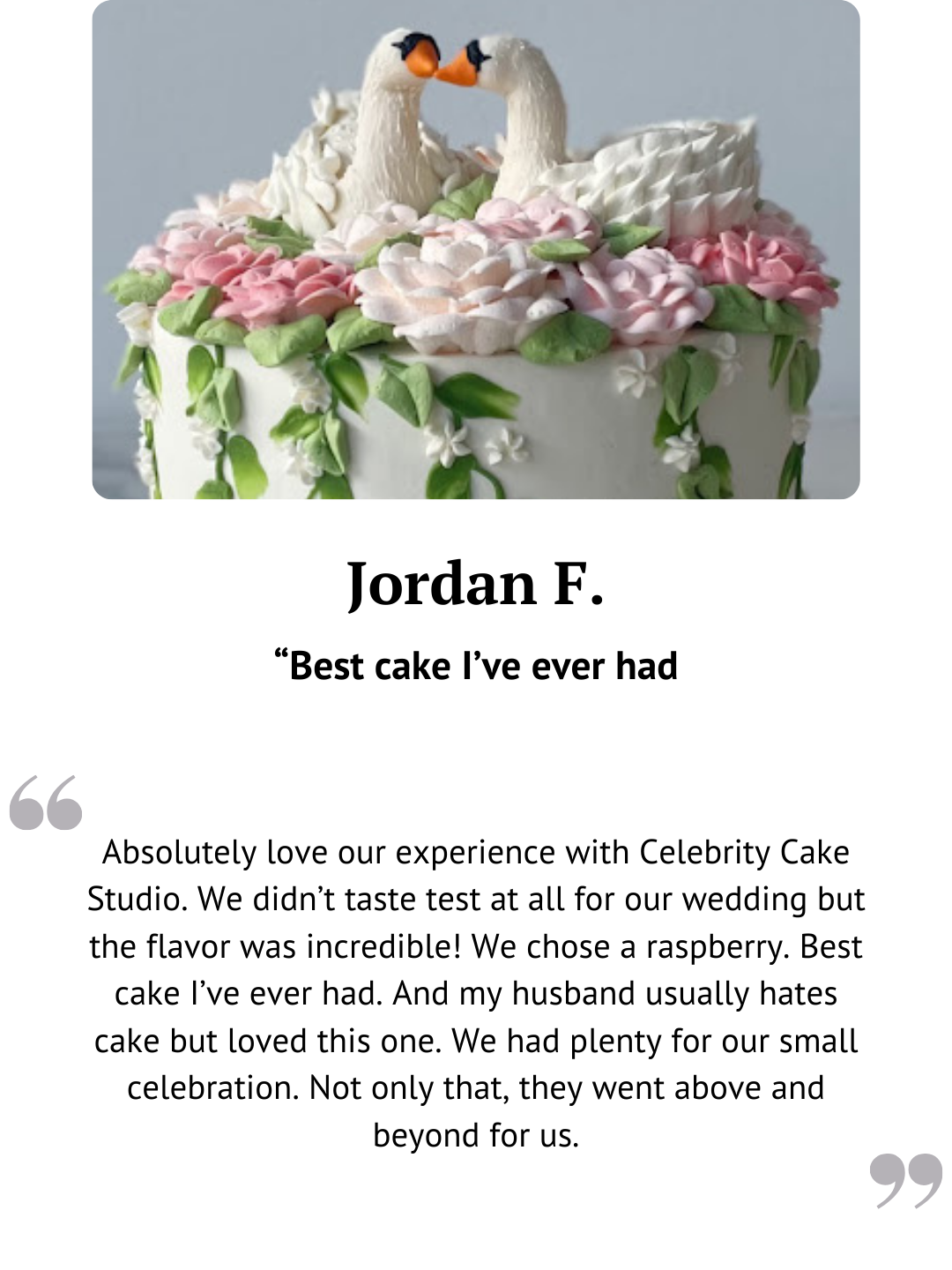 Floral wedding cake topped with bride and groom figurines