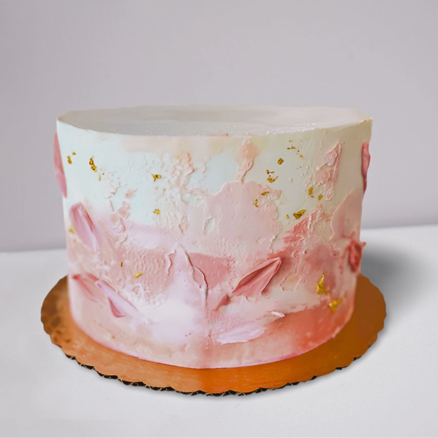 Cake with pink floral design on a white background