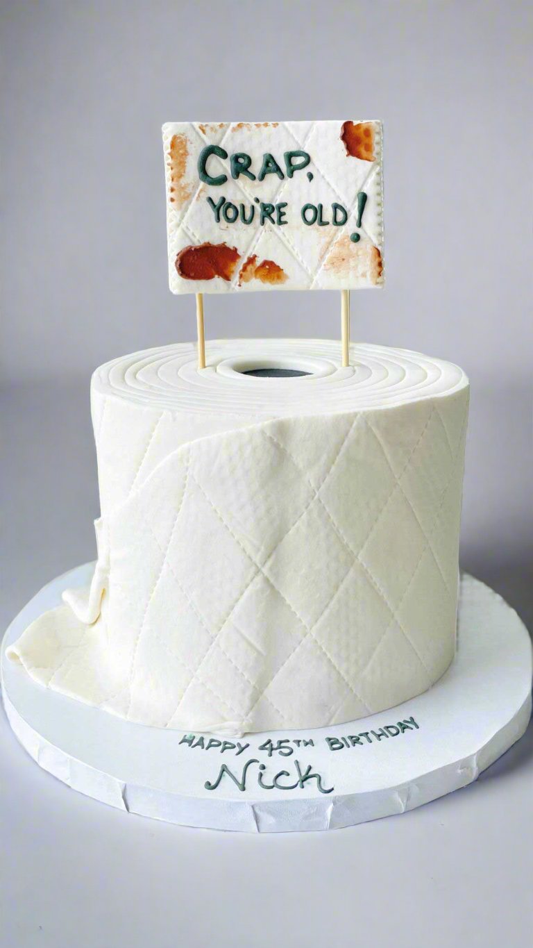 Simple white cake with a "Clean Plate Club" flag topper on a white background