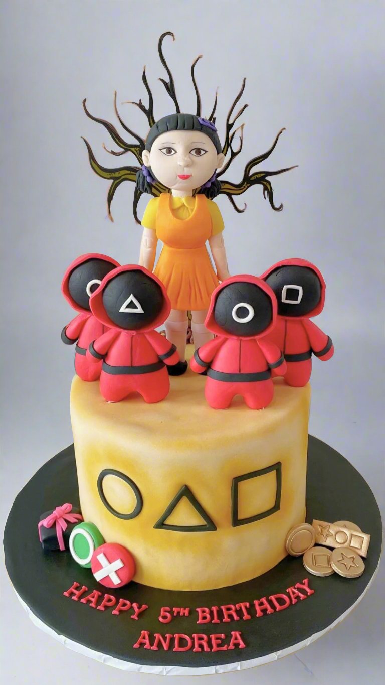 Squid Game-themed cake – A cake decorated with Squid Game symbols, characters, and a doll topper