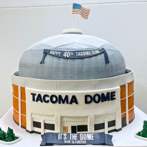 A novelty cake designed to look like the Tacoma Dome arena