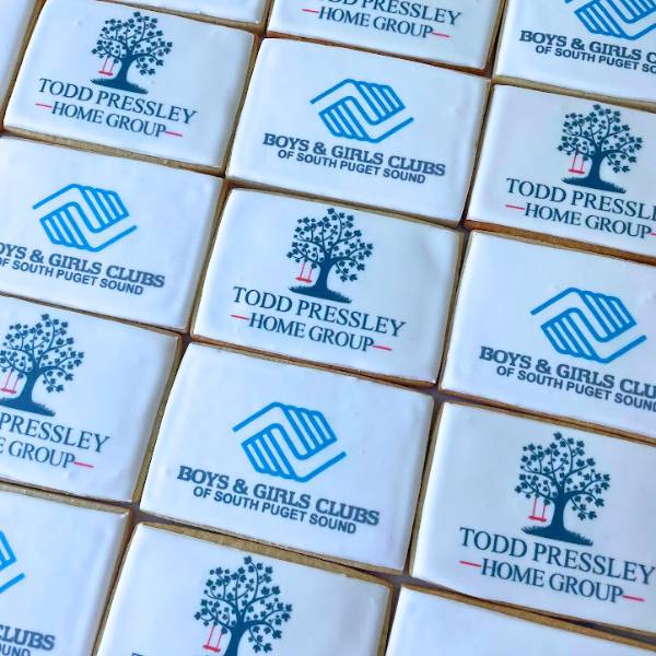 Cookies with logos of Todd Pressley Home Group, Boys & Girls Clubs of South Puget Sound on a white background