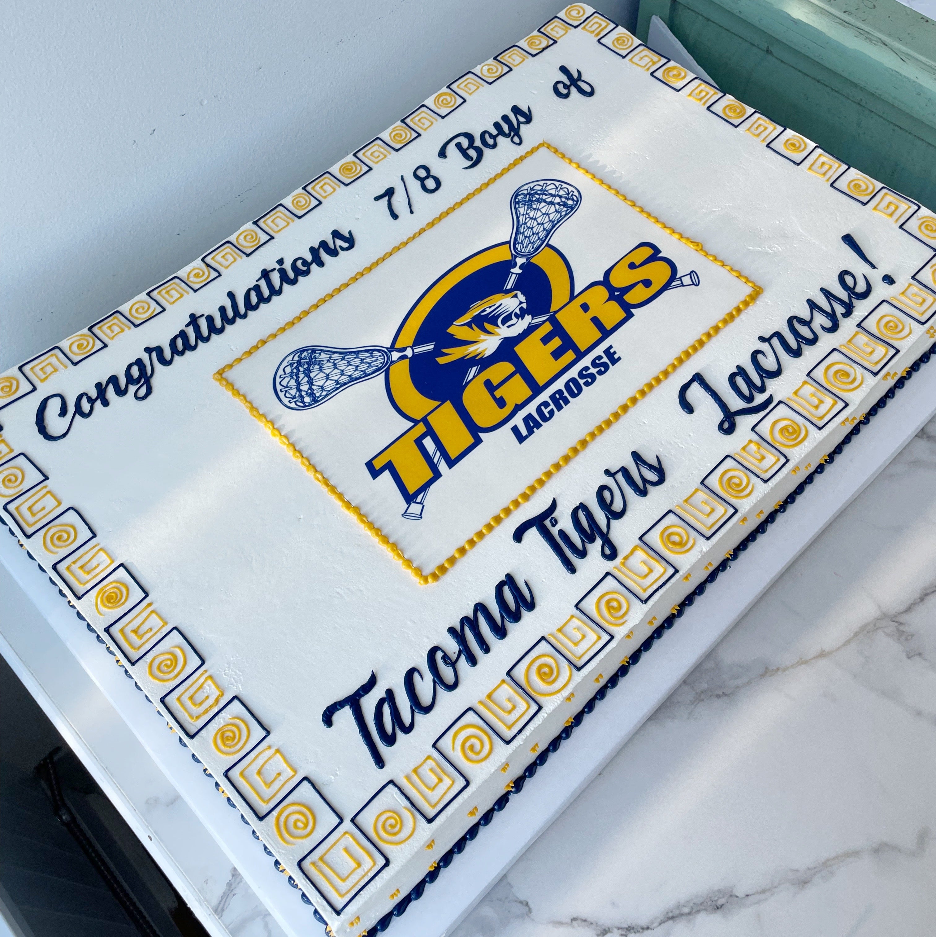 Congratulations card for Tacoma Tigers Lacrosse on a marble surface