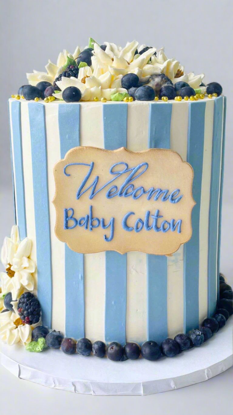 Custom Blue New Born Baby Cake with fondant berries and buttercream flowers | Celebrity Cake Studio