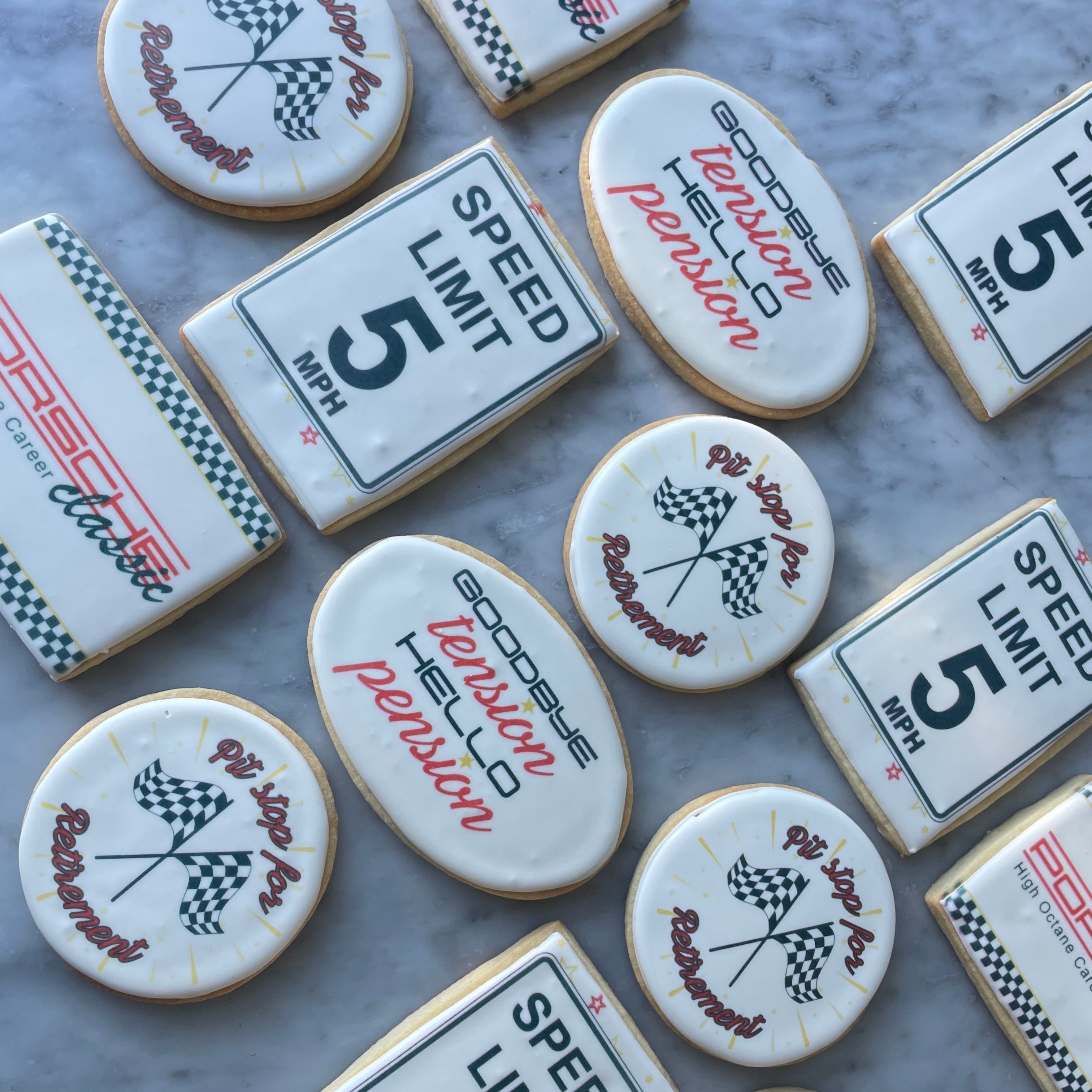 Decorative cookies shaped like speed limit signs and other designs