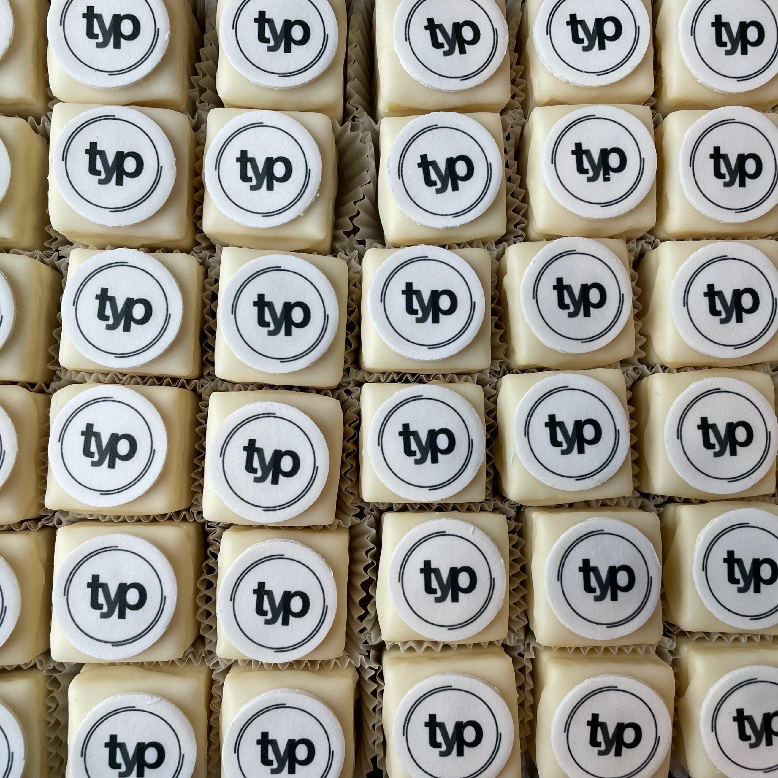 Box of cookies with 'typ' logo on a white background